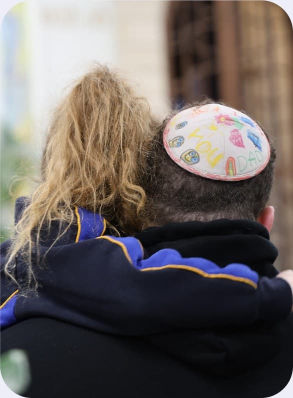 A student wearing a hand-painted kippah
